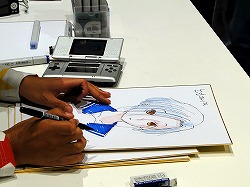 画像集#013のサムネイル/［TGS 2009］“自分の彼女”の似顔絵をミノ☆タロー氏に書いてもらえる抽選イベントも。「ラブプラス」の「デキシーズ 幕張出張所」レポート