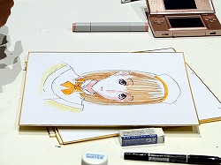 画像集#014のサムネイル/［TGS 2009］“自分の彼女”の似顔絵をミノ☆タロー氏に書いてもらえる抽選イベントも。「ラブプラス」の「デキシーズ 幕張出張所」レポート